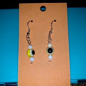 Yellow evil eye dangle earrings